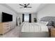 Main bedroom with a large bed and plenty of dresser space at 10918 Bellbrook Cir, Highlands Ranch, CO 80130