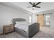 Primary bedroom features a barn door and a large bed at 10918 Bellbrook Cir, Highlands Ranch, CO 80130