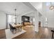 Open concept dining room and living room with hardwood flooring at 10918 Bellbrook Cir, Highlands Ranch, CO 80130