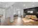 Open concept dining room with a wooden table and black chairs at 10918 Bellbrook Cir, Highlands Ranch, CO 80130