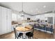 Modern kitchen with an eat-in area and a view of the living room at 10918 Bellbrook Cir, Highlands Ranch, CO 80130