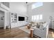 Spacious living room with high ceilings, built-in shelving, and hardwood floors at 10918 Bellbrook Cir, Highlands Ranch, CO 80130