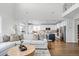 Open concept living room and kitchen with hardwood floors at 10918 Bellbrook Cir, Highlands Ranch, CO 80130