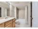 Bathroom with tub and shower, plus a wooden vanity at 5201 S Fox St # 102, Littleton, CO 80120
