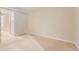 Bedroom featuring neutral carpet, an adjacent bathroom and a walk-in closet at 5201 S Fox St # 102, Littleton, CO 80120