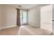 Bedroom with carpet floor and a connecting door to another room at 5201 S Fox St # 102, Littleton, CO 80120