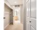 Walk-in closet leads to an ensuite bathroom with vanity at 5201 S Fox St # 102, Littleton, CO 80120