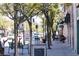 Quaint street view with sidewalk seating and tree-lined street perfect for relaxation and community engagement at 5201 S Fox St # 102, Littleton, CO 80120