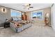 Cozy bedroom with nice natural light, neutral carpet and furniture at 7339 Carr St, Arvada, CO 80005