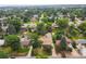 Residential neighborhood with mature trees; aerial view displays the houses below at 4040 Cody St, Wheat Ridge, CO 80033