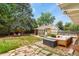 Private backyard offers a patio, storage shed, fenced yard, and mature trees at 4040 Cody St, Wheat Ridge, CO 80033