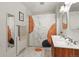 Stylish bathroom with double sinks, modern fixtures, and a unique shower curtain design at 4040 Cody St, Wheat Ridge, CO 80033