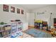 bedroom with wall decor, storage options and play area for all ages at 4040 Cody St, Wheat Ridge, CO 80033