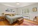 Bright bedroom with hardwood floors, a comfortable bed, and large windows offering natural light at 4040 Cody St, Wheat Ridge, CO 80033