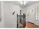 Entryway with hardwood floors, transom window, and a decorative bird at 4040 Cody St, Wheat Ridge, CO 80033