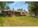 Charming brick home with a well-manicured front yard and a welcoming porch at 4040 Cody St, Wheat Ridge, CO 80033