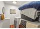Practical laundry room boasts modern appliances, wooden floors, and convenient utility sink at 4040 Cody St, Wheat Ridge, CO 80033