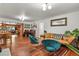 Open concept living room with hardwood floors, stylish furniture, and bright lighting at 4040 Cody St, Wheat Ridge, CO 80033