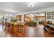 Inviting living room with wood floors, beamed ceilings, and a cozy, curved sofa for comfortable seating at 4040 Cody St, Wheat Ridge, CO 80033