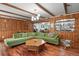 Spacious living room with wood floors, beamed ceilings, and a comfortable sectional sofa at 4040 Cody St, Wheat Ridge, CO 80033
