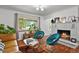 Cozy living room with fireplace, bright window, and stylish furniture at 4040 Cody St, Wheat Ridge, CO 80033