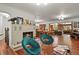 Spacious living room featuring a stone fireplace, hardwood floors, and stylish decor at 4040 Cody St, Wheat Ridge, CO 80033