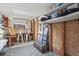 Studio space with a skylight, exposed brick, shelving, and a black and white rug at 4040 Cody St, Wheat Ridge, CO 80033