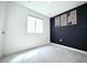 Minimalist bedroom featuring sleek accent wall and modern design at 5027 N Walden Way, Denver, CO 80249