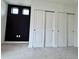 Bedroom featuring a dark accent wall with closet space at 5027 N Walden Way, Denver, CO 80249