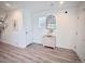 Inviting entryway featuring light wood floors, white walls, and stylish decor at 5027 N Walden Way, Denver, CO 80249