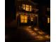 Charming two-story home featuring a cozy porch, balcony, and illuminated pathway for an inviting ambiance at 5027 N Walden Way, Denver, CO 80249