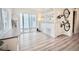 Bright, open-concept living space with sliding glass doors, modern flooring, and contemporary decor at 5027 N Walden Way, Denver, CO 80249