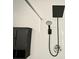 Close-up of a modern shower featuring black fixtures and a sleek design at 5027 N Walden Way, Denver, CO 80249