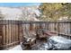 Cozy backyard patio with wooden deck, hot tub, and seating at 8867 W Floyd Ave, Lakewood, CO 80227