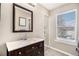 Clean bathroom with a vanity and a large mirror at 8867 W Floyd Ave, Lakewood, CO 80227