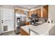 Modern kitchen featuring stainless steel appliances and ample cabinetry at 8867 W Floyd Ave, Lakewood, CO 80227