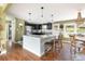 Modern kitchen featuring granite counters and dark cabinets at 5080 S Inca Dr, Englewood, CO 80110