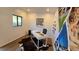 White home office with large banner, desk, and hardwood floors at 5080 S Inca Dr, Englewood, CO 80110