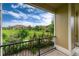 Relaxing balcony view showcasing well-maintained community landscaping with vibrant yellow roses at 6222 Kilmer Loop # 103, Golden, CO 80403
