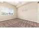 Empty bedroom with plush carpet and a large window offering great natural light at 6222 Kilmer Loop # 103, Golden, CO 80403