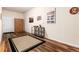 Versatile bonus room featuring stylish decor, wood floors, and a neutral color palette at 6222 Kilmer Loop # 103, Golden, CO 80403