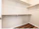 Walk-in closet offers abundant shelving and wood look floors at 6222 Kilmer Loop # 103, Golden, CO 80403