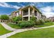 Well-maintained condo building with stone accents, inviting patios, and lush landscaping at 6222 Kilmer Loop # 103, Golden, CO 80403