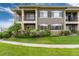 Beautiful condo with manicured lawn and blooming bushes, nestled in a serene community at 6222 Kilmer Loop # 103, Golden, CO 80403