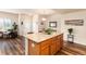 Kitchen island provides bar seating and countertop space, view to entry at 6222 Kilmer Loop # 103, Golden, CO 80403