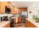 Updated kitchen with stainless steel appliances and granite countertops at 6222 Kilmer Loop # 103, Golden, CO 80403