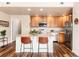 Modern kitchen featuring stainless steel appliances and an island with bar stool seating at 6222 Kilmer Loop # 103, Golden, CO 80403
