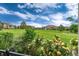 Picturesque view overlooking the well-manicured landscape, lush greenery, and neighborhood at 6222 Kilmer Loop # 103, Golden, CO 80403