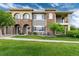 Multi-level townhouse with stone accents, manicured lawn, and inviting curb appeal at 6222 Kilmer Loop # 103, Golden, CO 80403
