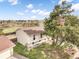 Aerial shot of a lovely tan home with a detached garage at 15691 E Atlantic Cir, Aurora, CO 80013